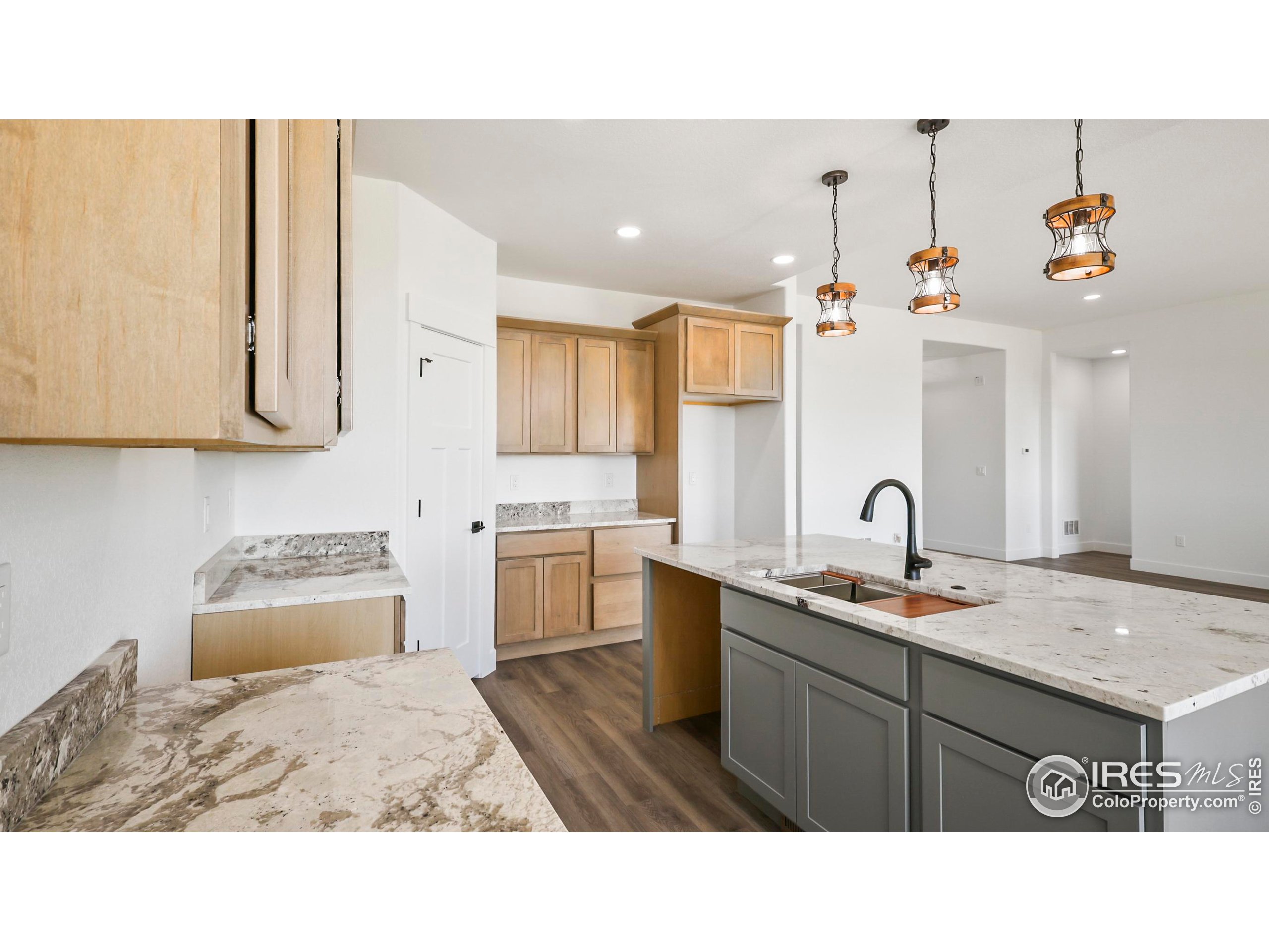 448 Cache Avenue Fort Morgan, CO 80701 - Photo 10 of 44 a kitchen with a sink a stove and cabinets