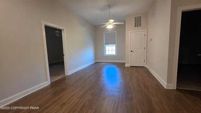 a view of livingroom with hardwood floor and window