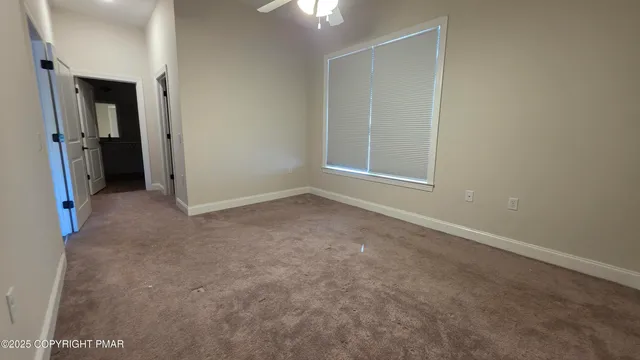 an empty room with closet area