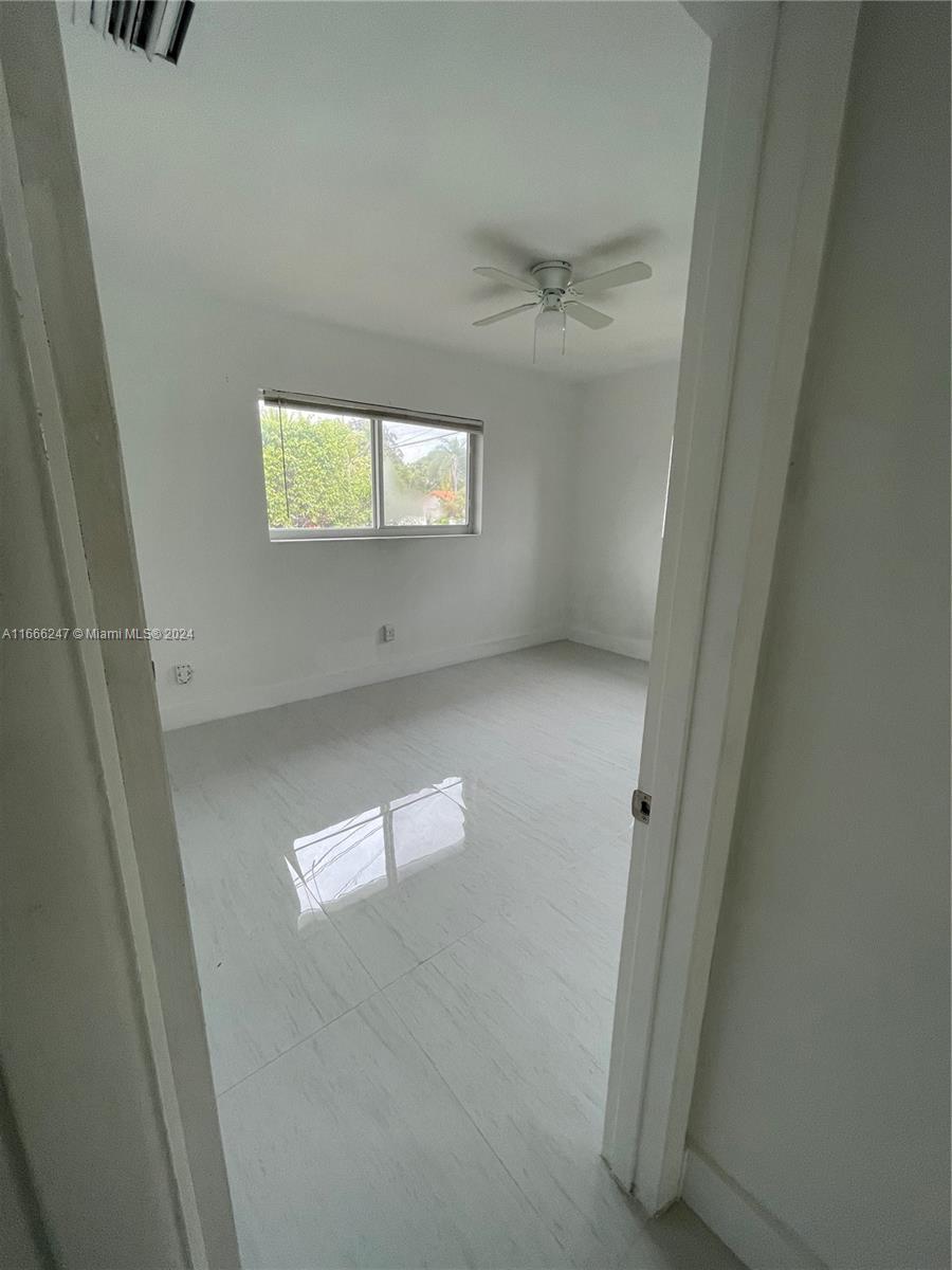 3112 Southwest 16th Street, Unit 3110 Miami, FL 33145 - Photo 15 of 19 an empty room with windows