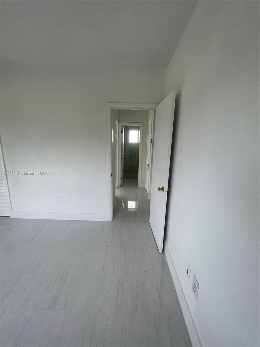 3112 Southwest 16th Street, Unit 3110 Miami, FL 33145 - Photo 17 of 19 a view of a hallway with staircase