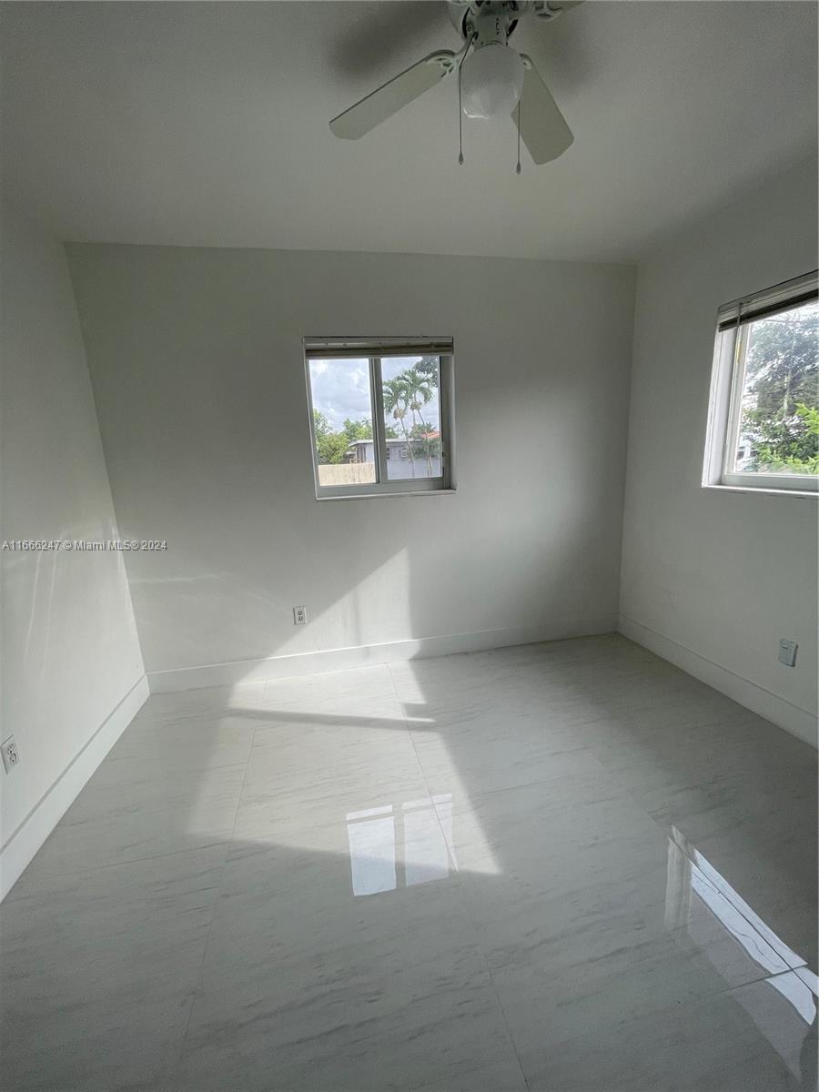 3112 Southwest 16th Street, Unit 3110 Miami, FL 33145 - Photo 18 of 19 en empty room with windows