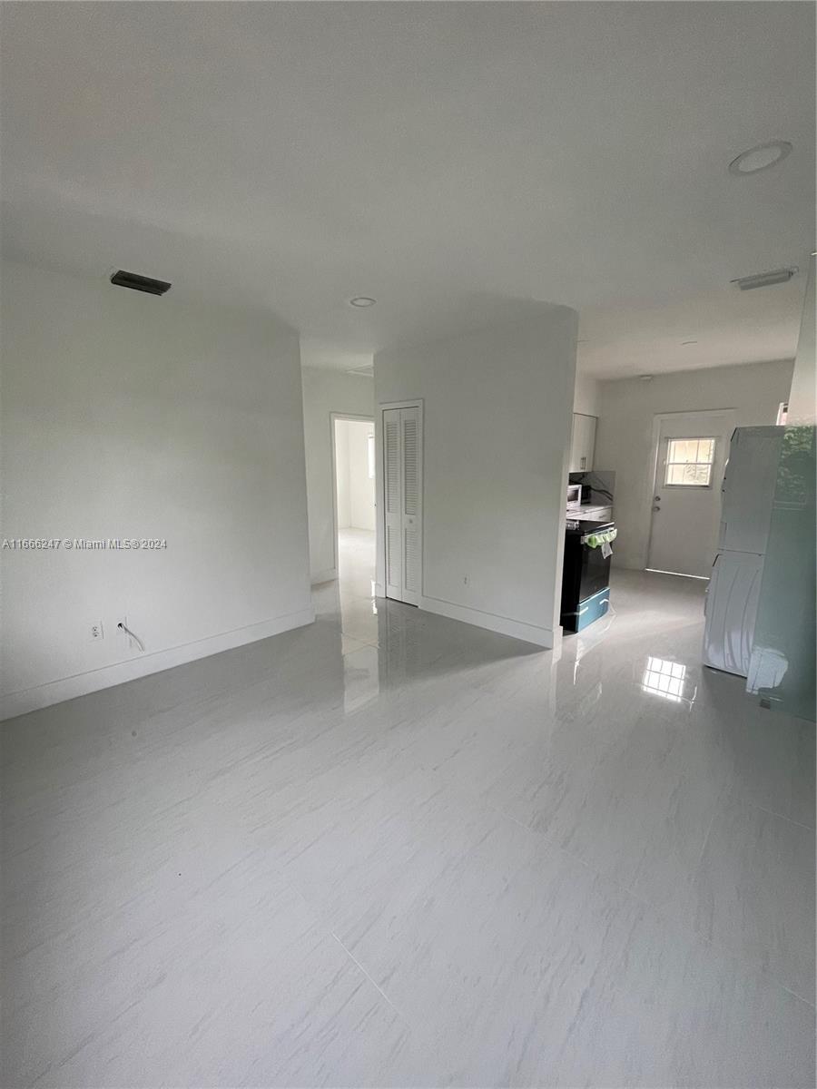 3112 Southwest 16th Street, Unit 3110 Miami, FL 33145 - Photo 8 of 19 a view of empty room with wooden floor
