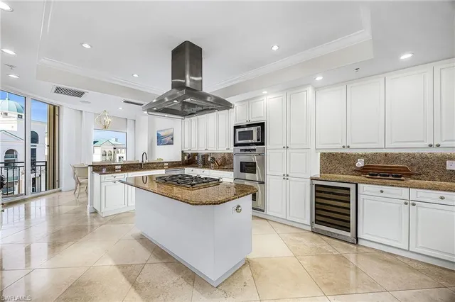 a kitchen with stainless steel appliances granite countertop a stove and a sink