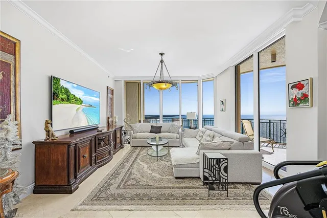 a living room with fireplace furniture and a flat screen tv