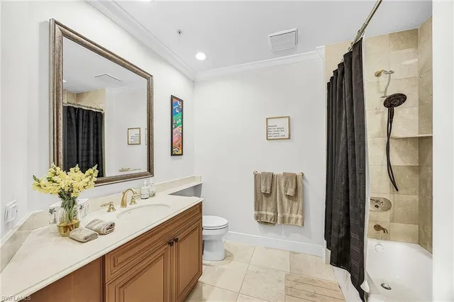 a spacious bathroom with a granite countertop sink and a mirror