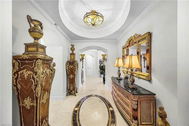 a view of living room with furniture and chandelier