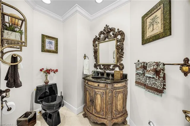 a table with a vase and flowers on it