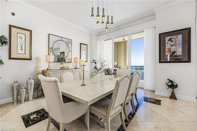 a view of a a dining room with furniture window and wooden floor