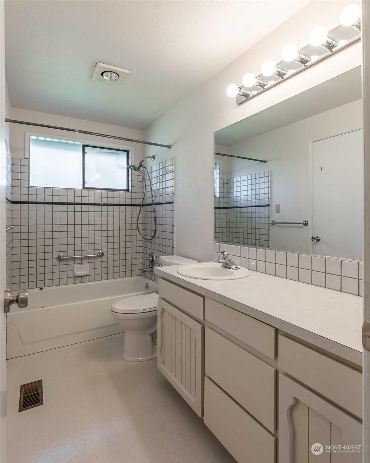 1004 Shaw Road Ferndale, WA 98248 - Photo 13 of 36 a bathroom with a bathtub shower sink vanity and toilet