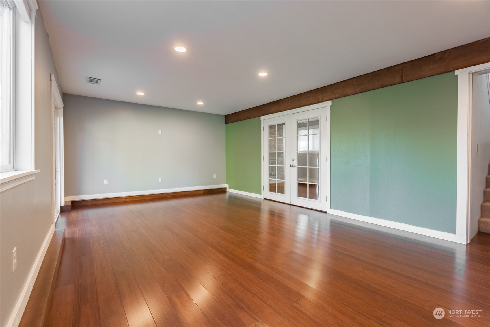 1004 Shaw Road Ferndale, WA 98248 - Photo 20 of 36 an empty room with wooden floor and windows