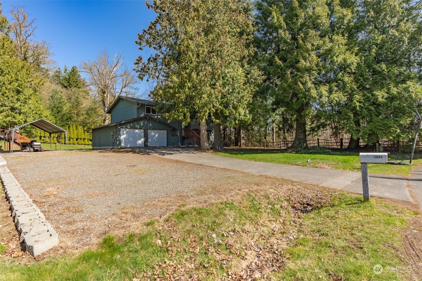 1004 Shaw Road Ferndale, WA 98248 - Photo 2 of 36 a house view with a trees