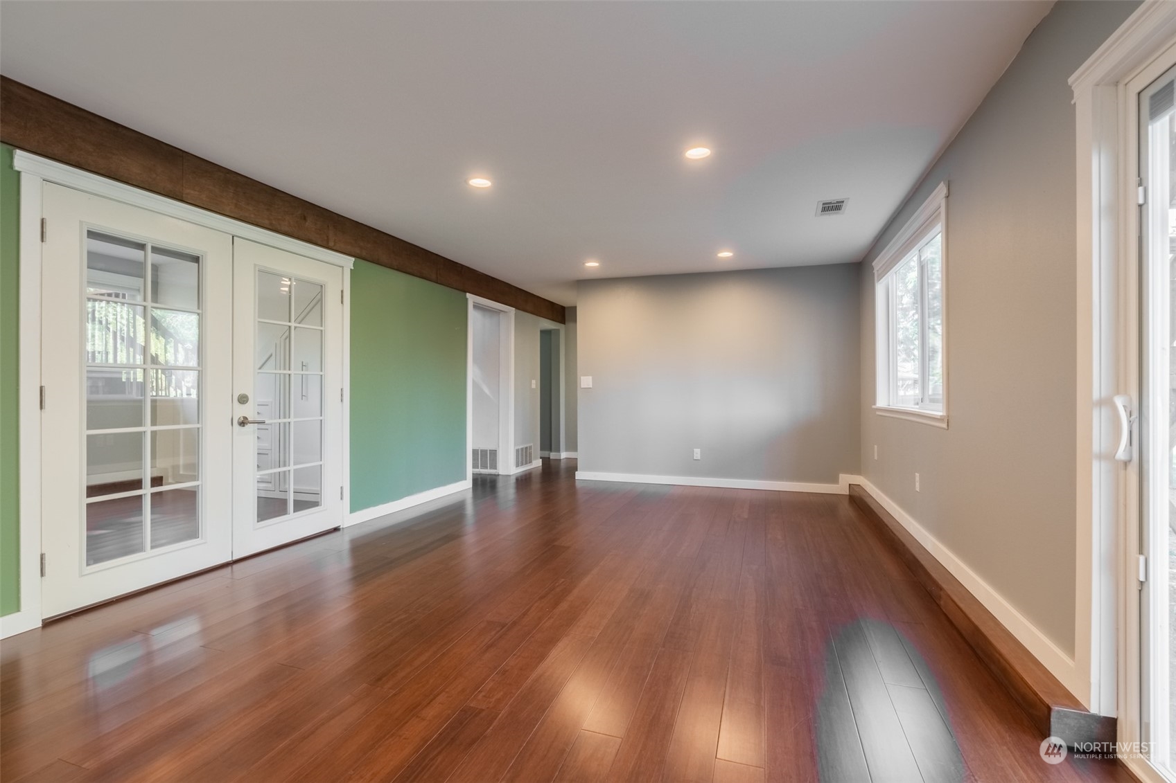 1004 Shaw Road Ferndale, WA 98248 - Photo 25 of 36 a view of an empty room with wooden floor and a window