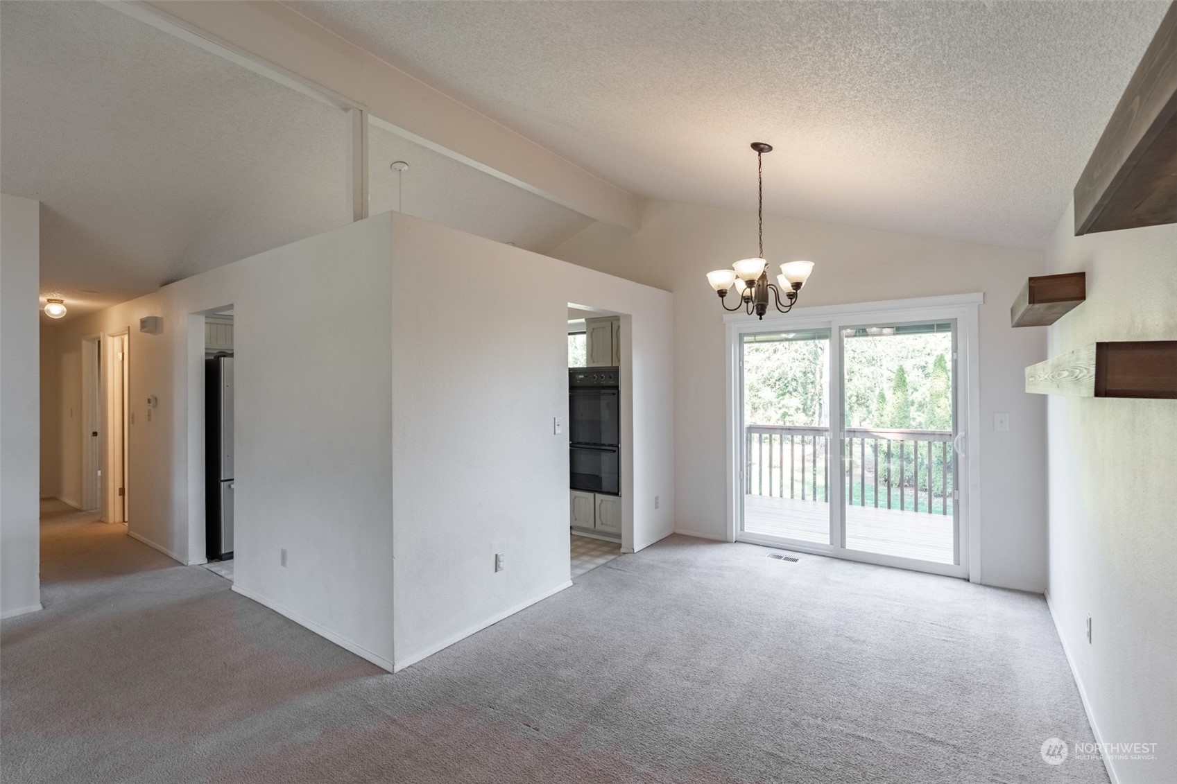 1004 Shaw Road Ferndale, WA 98248 - Photo 5 of 36 a view of a livingroom with a chandelier fan and windows