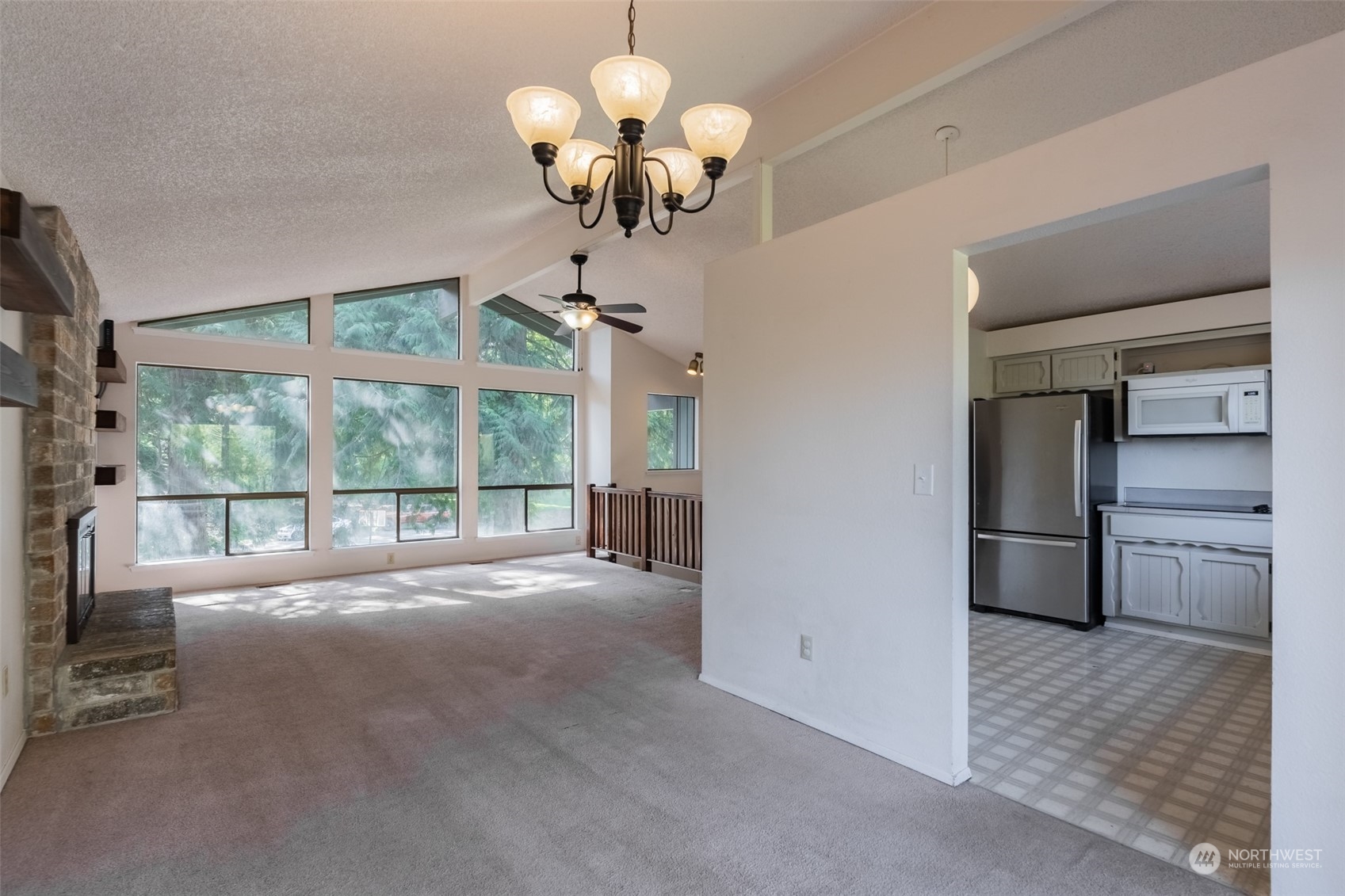 1004 Shaw Road Ferndale, WA 98248 - Photo 7 of 36 a view of a room with a chandelier furniture and windows