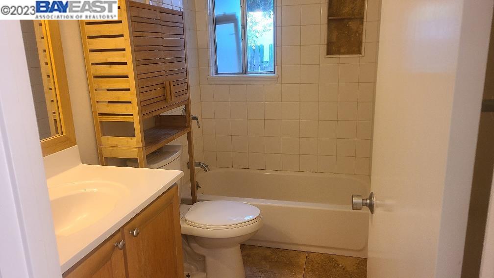 1501 L Street Davis, CA 95616 - Photo 12 of 23 a bathroom with a sink a toilet and shower