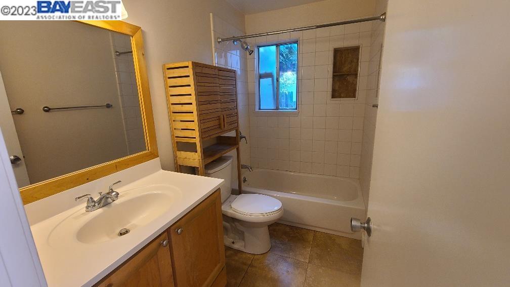 1501 L Street Davis, CA 95616 - Photo 13 of 23 a bathroom with a sink a toilet and shower