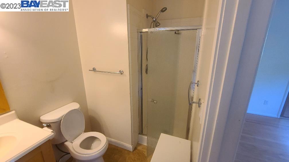 1501 L Street Davis, CA 95616 - Photo 17 of 23 a white toilet sitting next to a bathroom sink