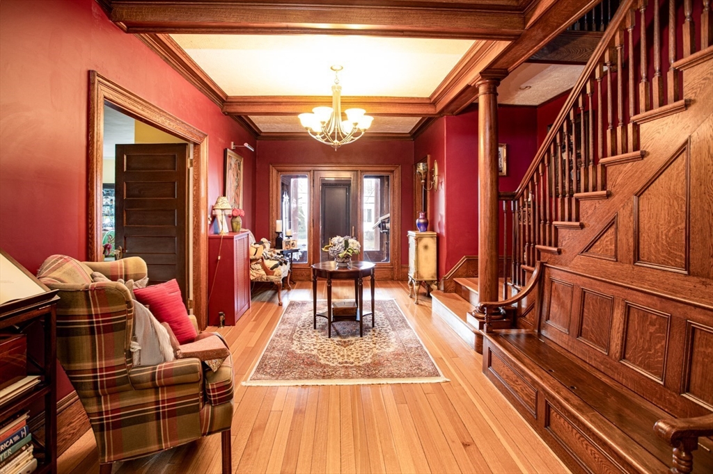 1231 Robeson Street Fall River, MA 02720 - Photo 15 of 39 a view of a dining room with furniture a chandelier and wooden floor