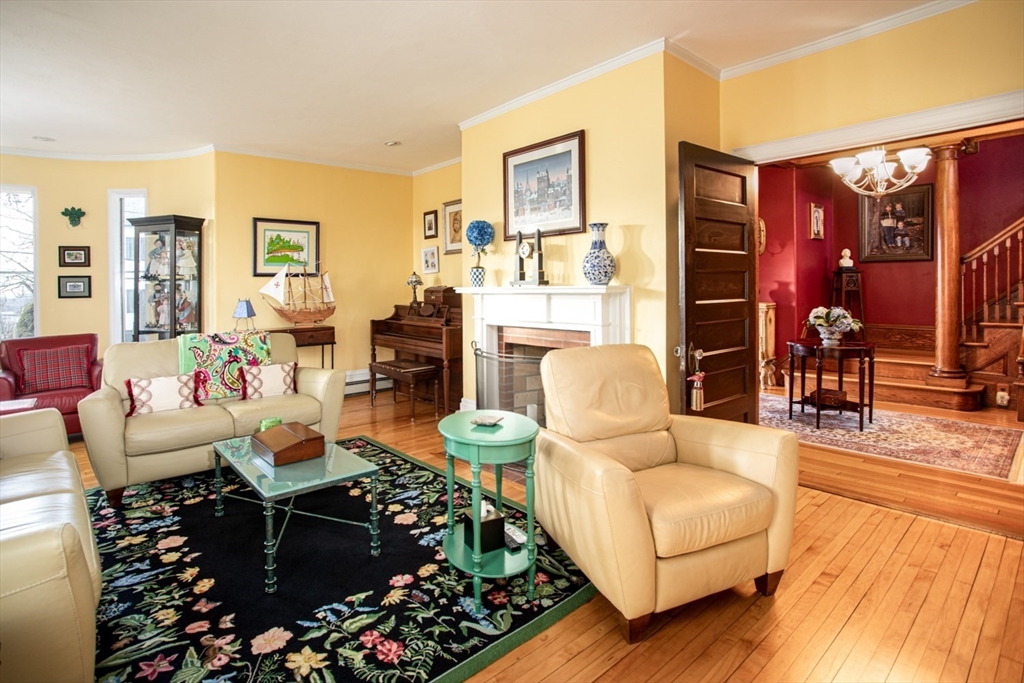 1231 Robeson Street Fall River, MA 02720 - Photo 17 of 39 a living room with furniture and a floor to ceiling window