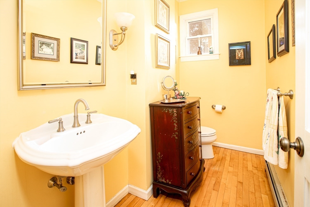 1231 Robeson Street Fall River, MA 02720 - Photo 21 of 39 a bathroom with a sink and a mirror