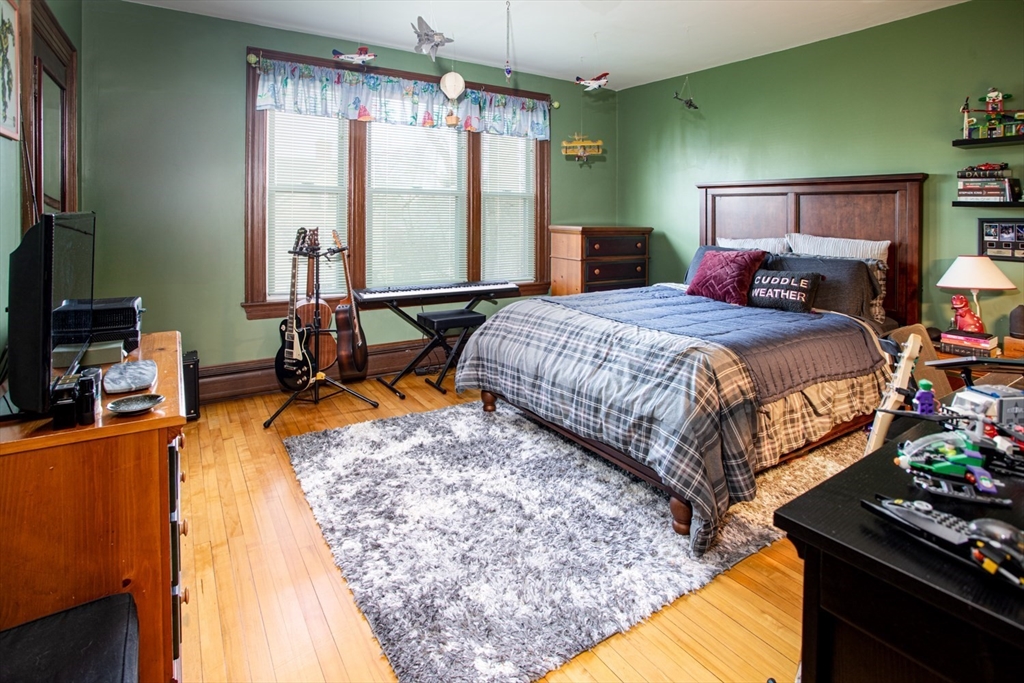 1231 Robeson Street Fall River, MA 02720 - Photo 28 of 39 a bed sitting in a bedroom next to a window