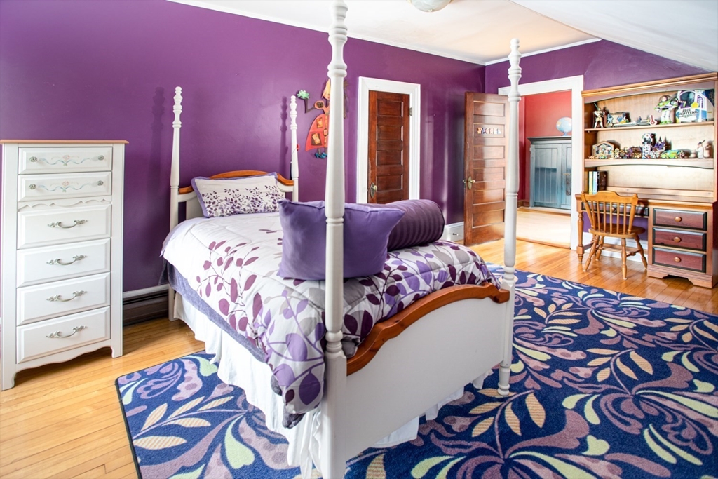 1231 Robeson Street Fall River, MA 02720 - Photo 32 of 39 a bedroom with a bed and dresser with mirror