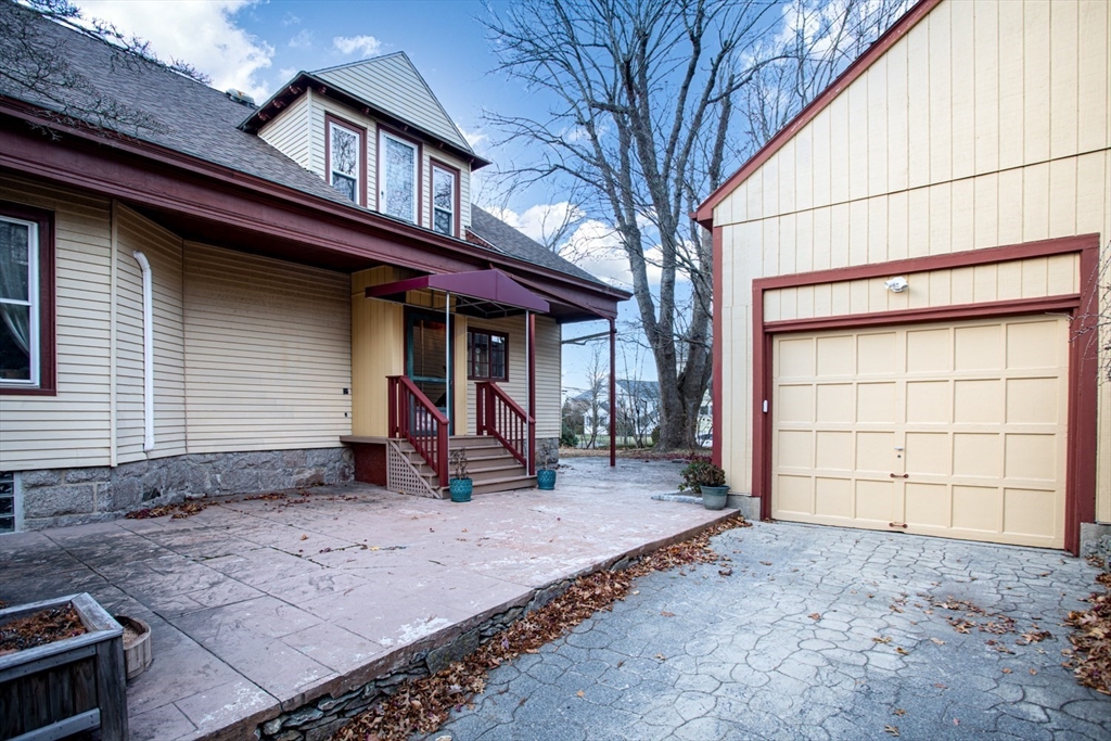1231 Robeson Street Fall River, MA 02720 - Photo 5 of 39 a view of a house with a backyard and a tree