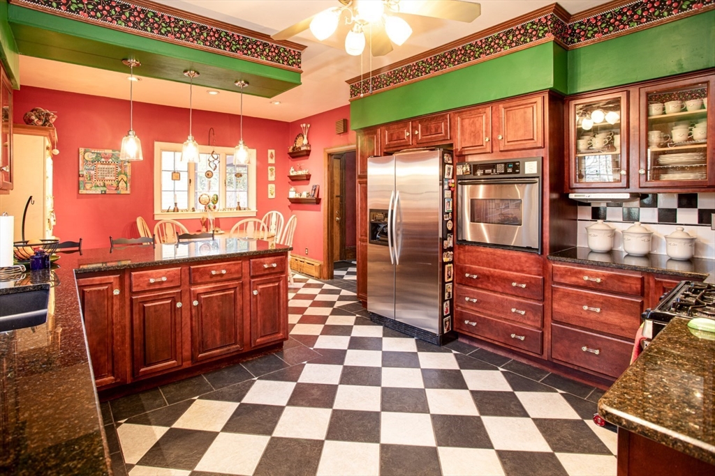 1231 Robeson Street Fall River, MA 02720 - Photo 10 of 39 a kitchen with stainless steel appliances granite countertop a sink and a cabinets