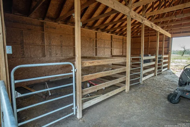 a view of an empty room with empty shelves