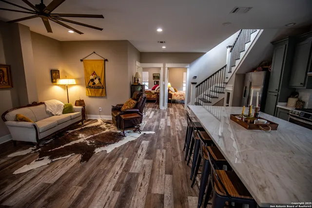 a kitchen with a table chairs stove and cabinets