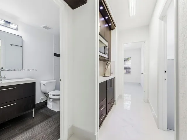 a bathroom with a toilet sink and a shower
