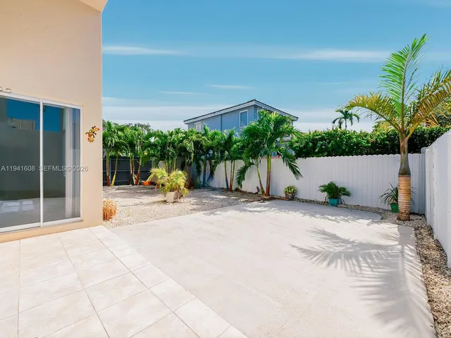 a view of a street with a building in the background