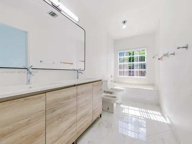 a bathroom with a sink and a bathtub