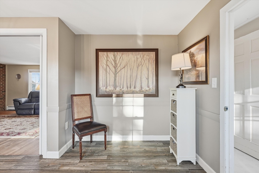 387 Massachusetts Avenue North Andover, MA 01845 - Photo 11 of 34 a view of a livingroom with wooden floor and a couch