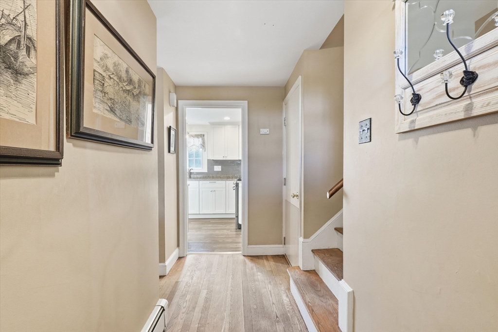 387 Massachusetts Avenue North Andover, MA 01845 - Photo 12 of 34 a view of a hallway with wooden floor and entryway