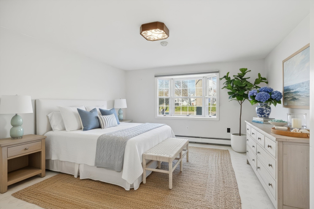 387 Massachusetts Avenue North Andover, MA 01845 - Photo 13 of 34 a bedroom with a bed and a window