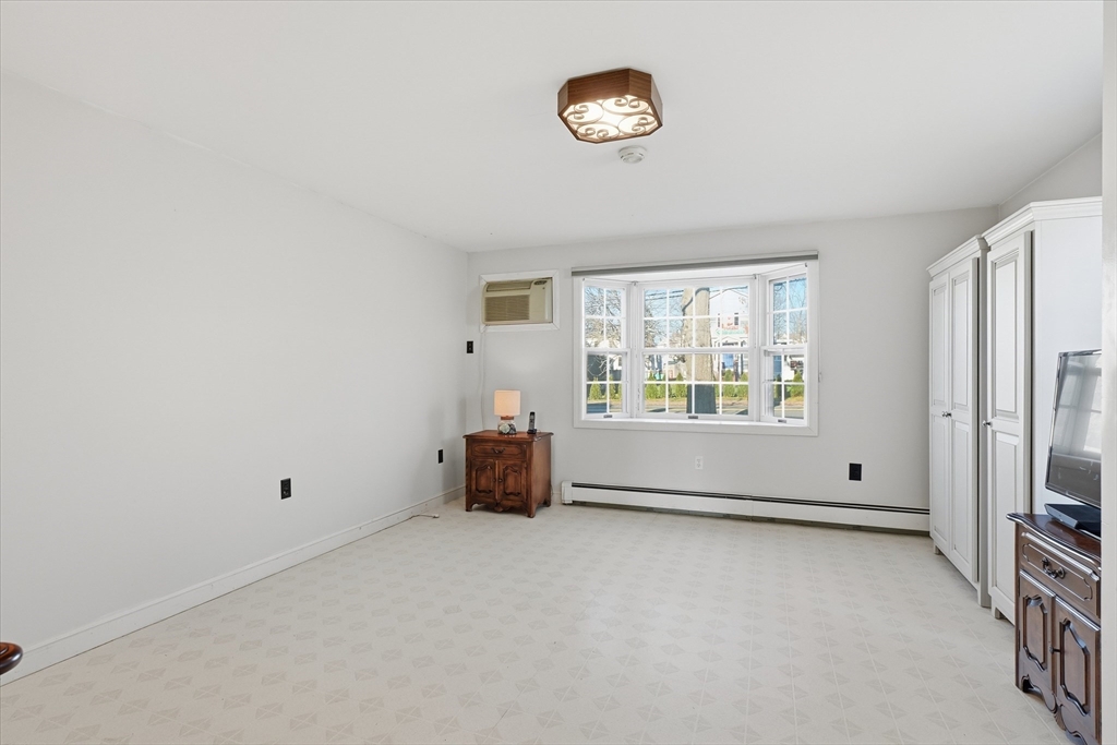 387 Massachusetts Avenue North Andover, MA 01845 - Photo 14 of 34 a view of an empty room with a window