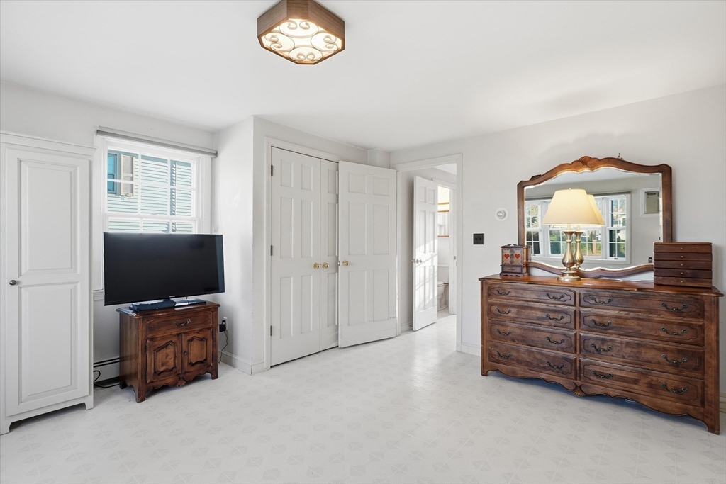 387 Massachusetts Avenue North Andover, MA 01845 - Photo 15 of 34 a living room with furniture and a flat screen tv
