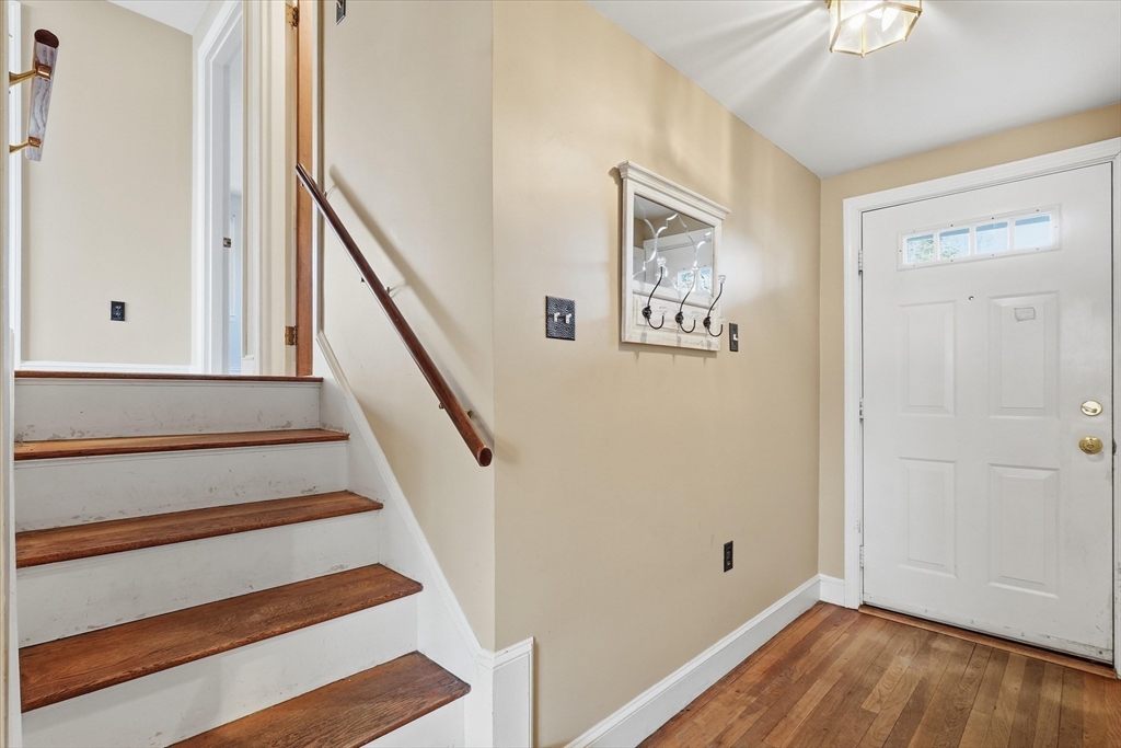 387 Massachusetts Avenue North Andover, MA 01845 - Photo 18 of 34 a view of entryway with wooden floor and stairs