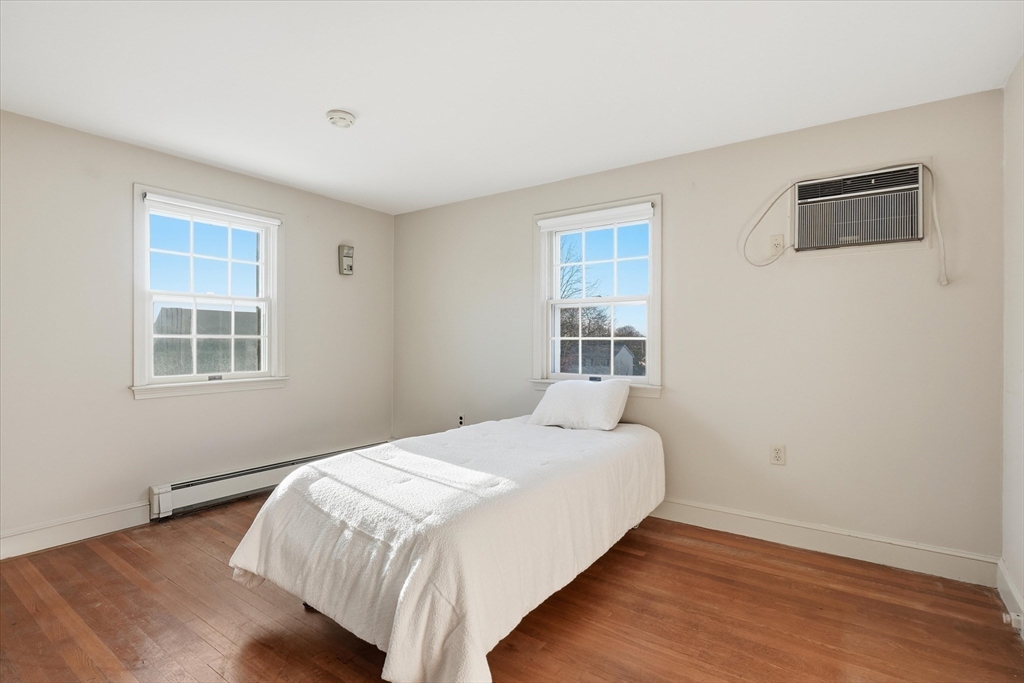 387 Massachusetts Avenue North Andover, MA 01845 - Photo 21 of 34 a bedroom with a bed and a window