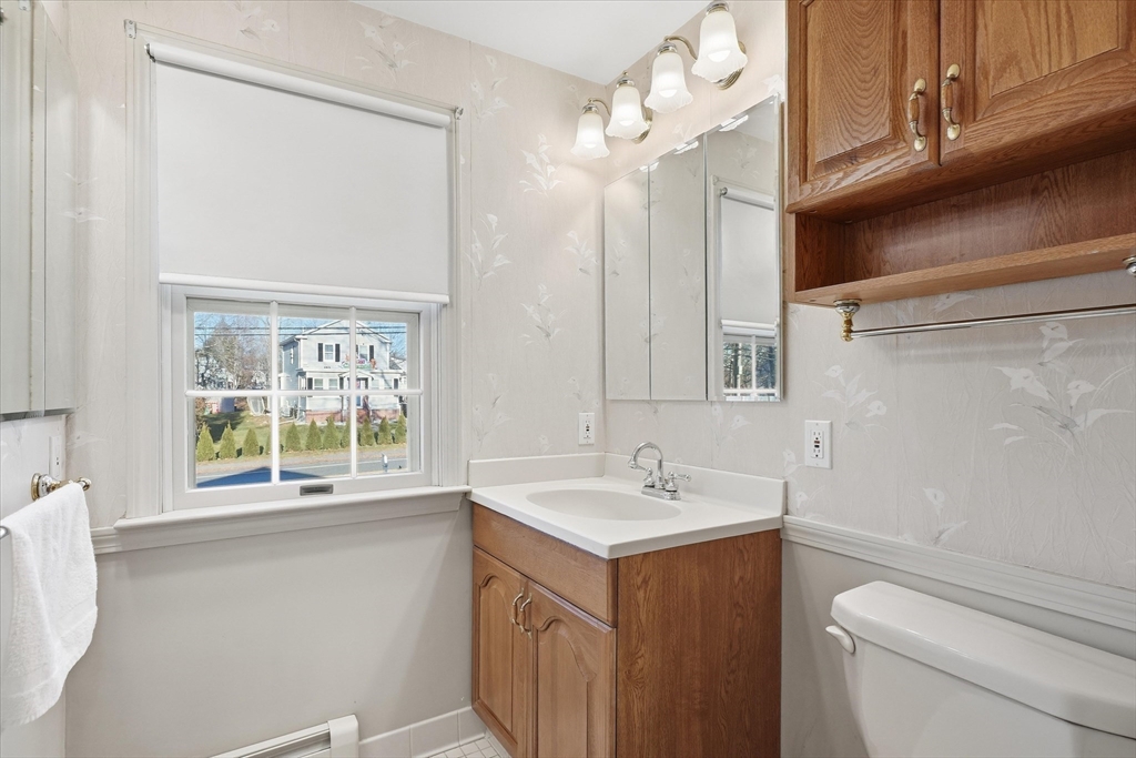 387 Massachusetts Avenue North Andover, MA 01845 - Photo 23 of 34 a bathroom with a sink a toilet and a window