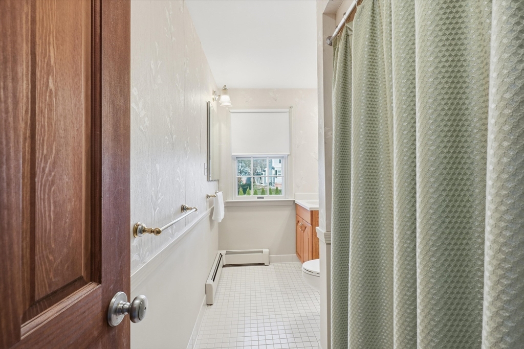 387 Massachusetts Avenue North Andover, MA 01845 - Photo 24 of 34 a bathroom with a sink and a mirror