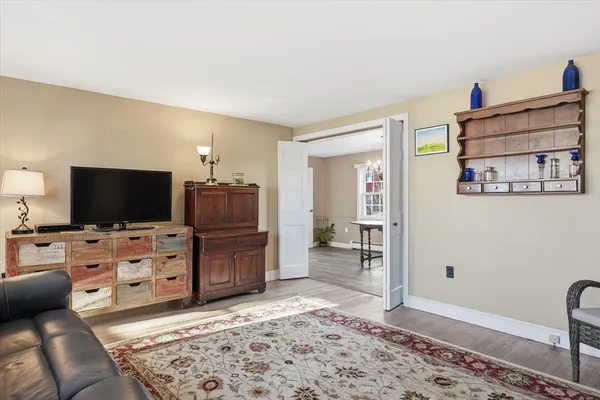 a view of a livingroom with furniture and cabinet