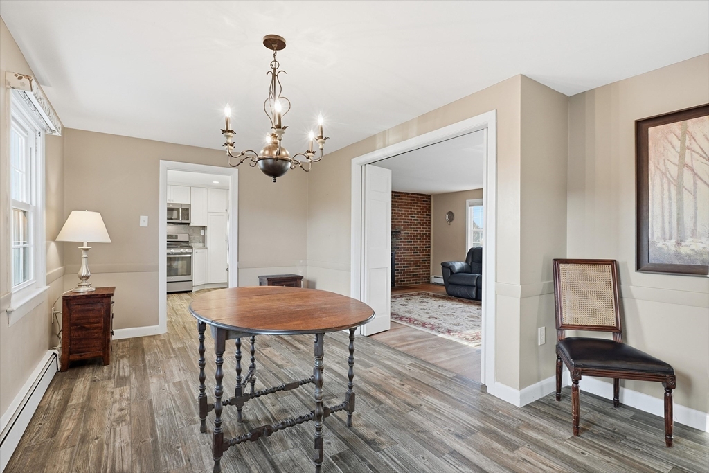 387 Massachusetts Avenue North Andover, MA 01845 - Photo 9 of 34 a view of a dining room with furniture and wooden floor