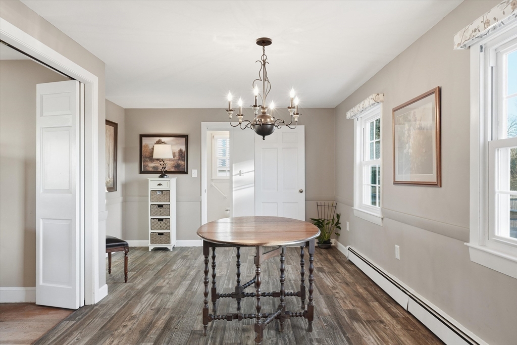 387 Massachusetts Avenue North Andover, MA 01845 - Photo 10 of 34 a view of a dining room with furniture and wooden floor