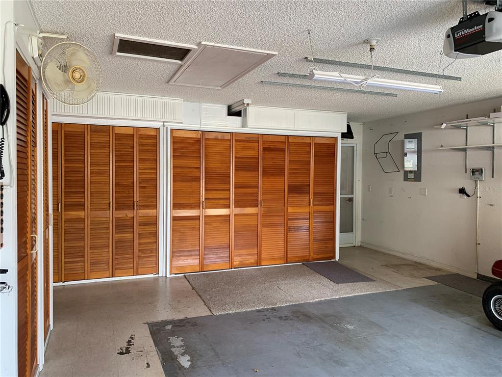 8340 Southwest 108th Pl Road Ocala, FL 34481 - Photo 28 of 32 Storage in garage, door leading into backyard