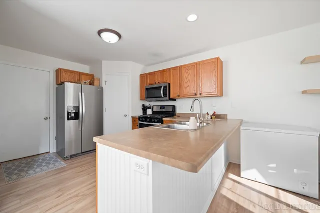 a view of a dining room with furniture and a window