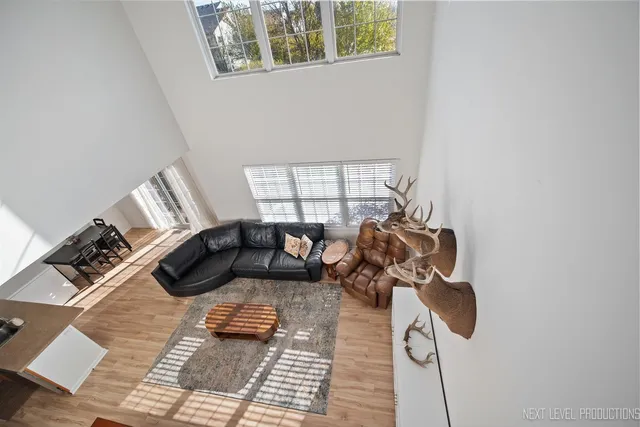 a bedroom with a large bed and a flat tv screen on dresser