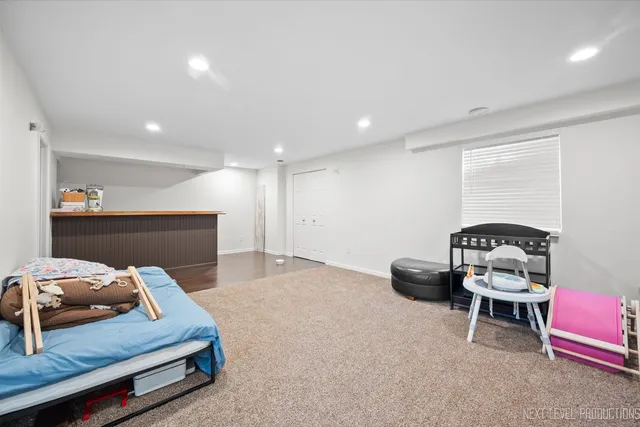 a view of a house with backyard and a tree
